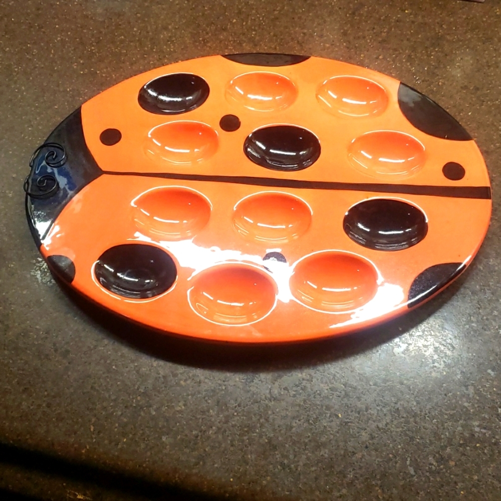 2006 Boston Warehouse Trading Corp. Beattle Orange/Black Deviled Egg Platter.